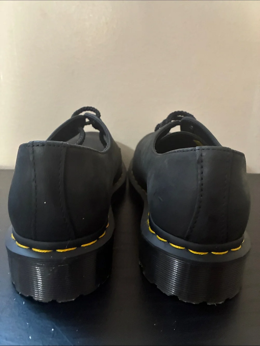 Dr. Martens 1461 leather oxfords feature the brand's signature yellow size 8